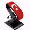 Handcrafted Turkey flag bracelet, adjustable beaded wrist accessory, displayed on a black stand.