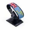Handcrafted Tuvalu flag bracelet, adjustable beaded wrist accessory, displayed on a black stand.