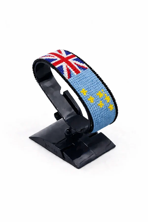 Handcrafted Tuvalu flag bracelet, adjustable beaded wrist accessory, displayed on a black stand.