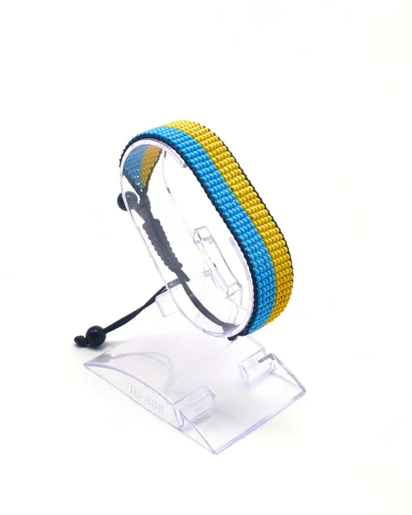 Ukraine flag bracelet handcrafted in authentic flag colors on Clear Stand.