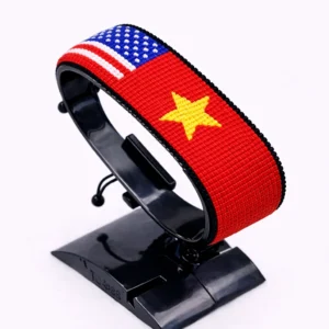 Vietnam USA combo flag bracelet with red, yellow, and American flag beads, handcrafted adjustable beaded wrist accessory.