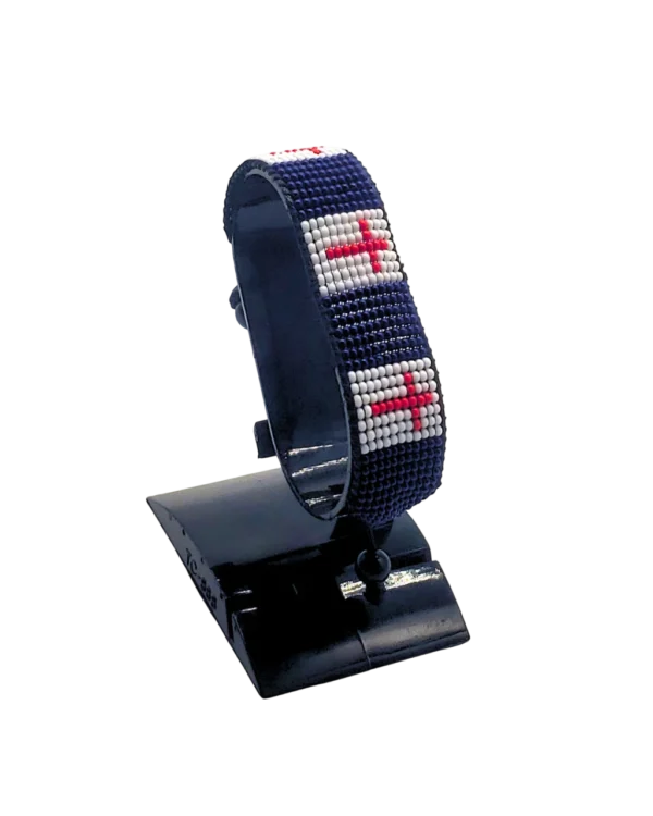 Wales flag bracelet handcrafted in authentic flag colors on Black Stand.
