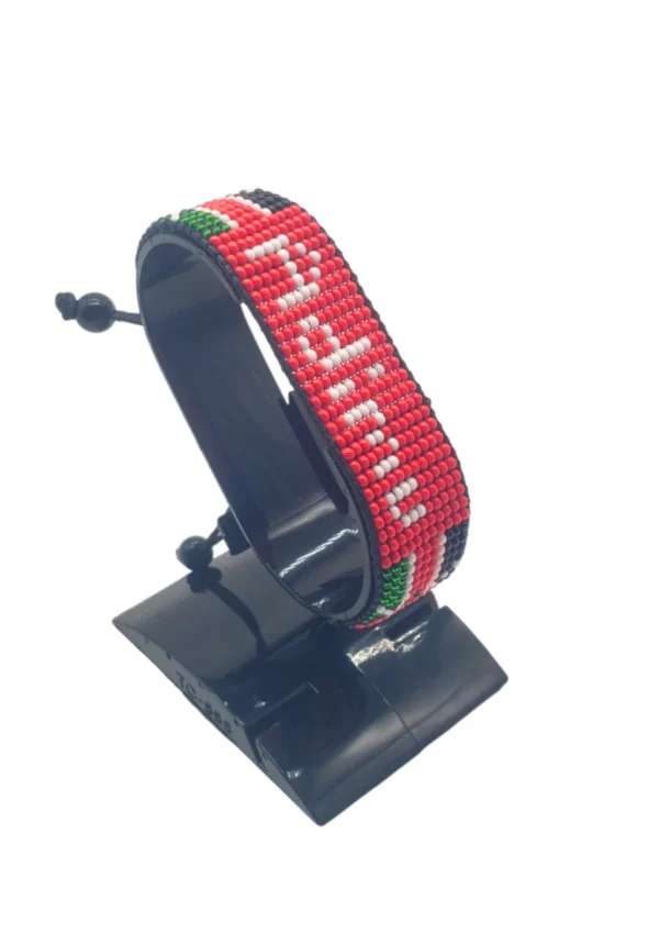 Adimu Flag bracelet handcrafted in authentic Corporate colors on Black Stand.