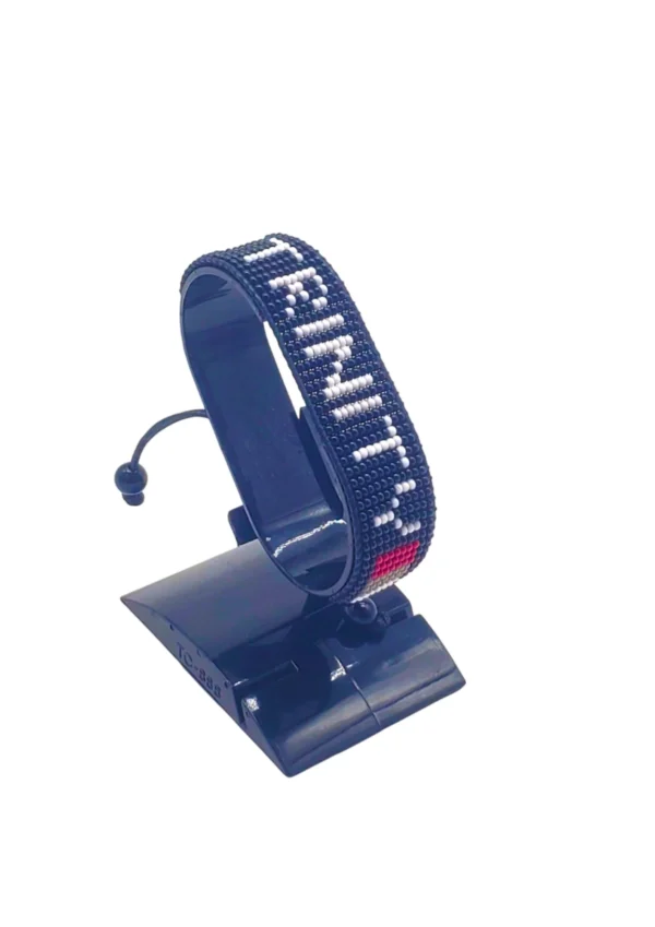 Trinity Flag bracelet handcrafted in authentic Corporate colors on Black Stand.