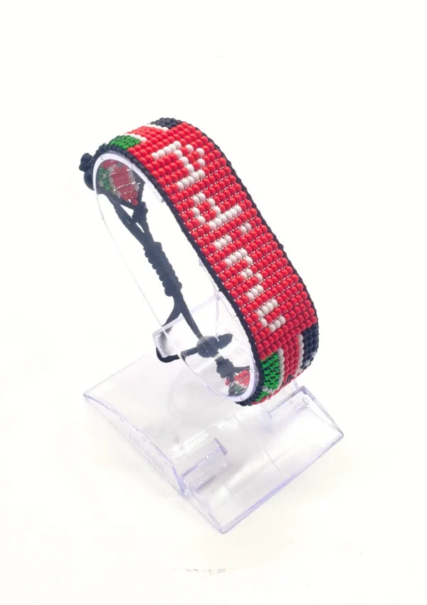 Adimu Flag bracelet handcrafted in authentic Corporate colors on Clear Stand.