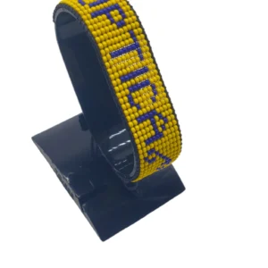 Optica Flag bracelet handcrafted in authentic Corporate colors on Black Stand.