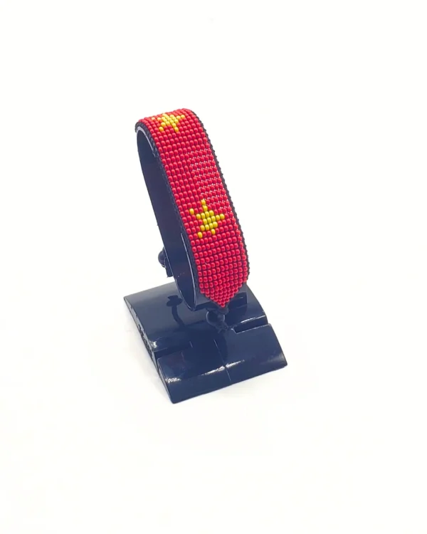 China flag bracelet handcrafted in authentic flag colors on Black Stand.