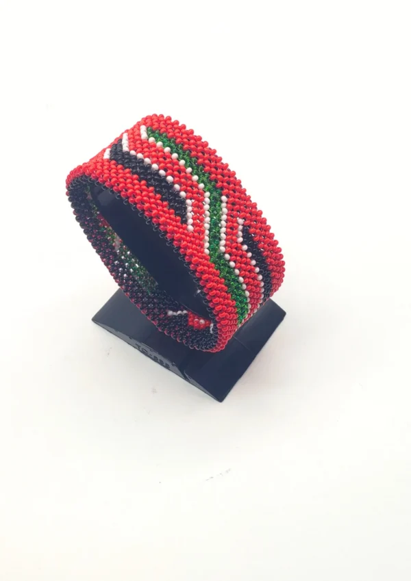 Kenya flag bracelet handcrafted in authentic flag colors on Black Stand.