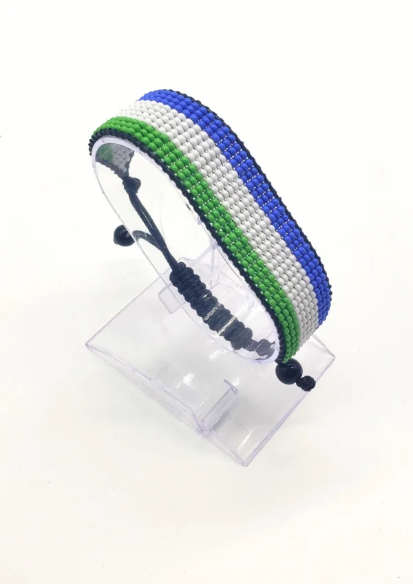 Sierra Leone flag bracelet handcrafted in authentic flag colors on Clear Stand.