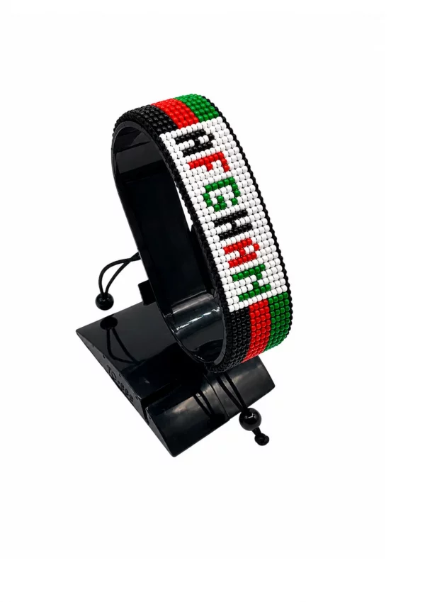 Afghanistan Flag Bracelet With Name Adjustable handcrafted with beadwork in the colors of the Afghanistan flag and the name "Afghanistan".