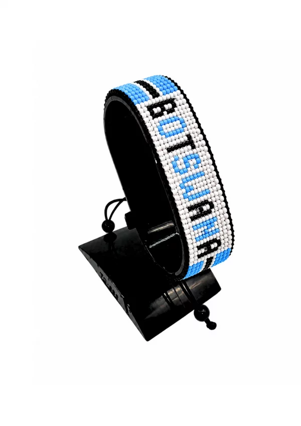 Botswana Flag Bracelet With Name Adjustable handcrafted with beadwork in the colors of the Botswana flag and the name "Botswana".