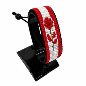 Canada Flag Bracelet for Women handcrafted with beadwork in the colors of the Canada flag featuring an elegant rose centerpiece.