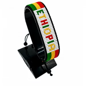 Ethiopia Flag Bracelet With Name Adjustable handcrafted with beadwork in the colors of the Ethiopia flag featuring the name ETHIOPIA.