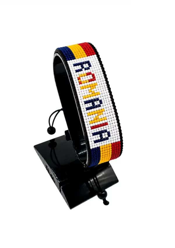 Romania Flag Bracelet With Name Adjustable handcrafted with beadwork in the colors of the Romania flag featuring the name ROMANIA.