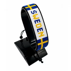 Sweden Flag Bracelet With Name Adjustable handcrafted with beadwork in the colors of the Sweden flag and the name "Sweden".