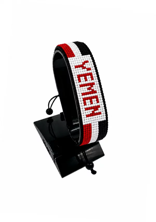Yemen Flag Bracelet With Name Adjustable handcrafted with beadwork in the colors of the Ukraine flag featuring the name YEMEN.